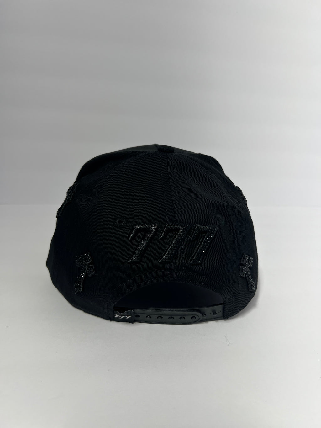 All black 777 with crosses and rhinestones